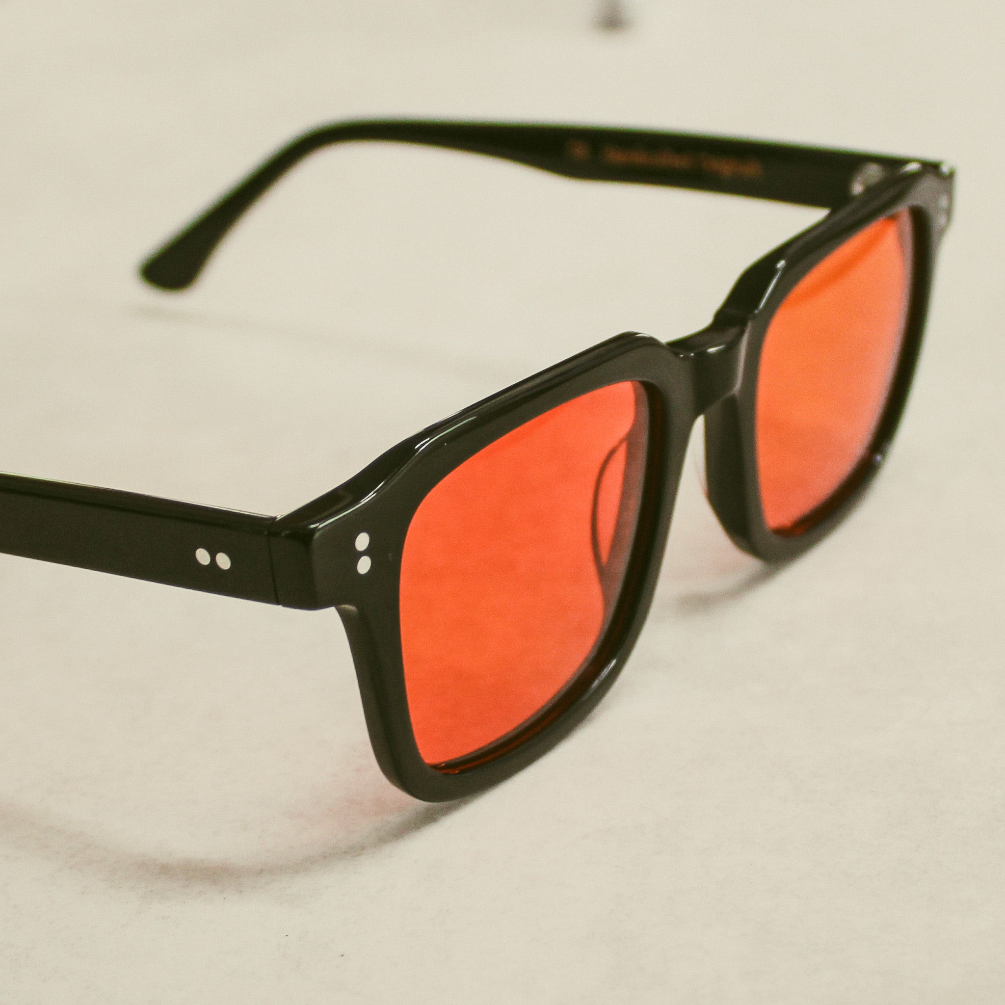 Black frame orange lens sunglasses best sale